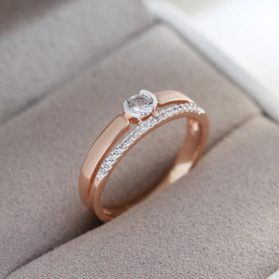 Dobbelt ring belagt i 18kt rosa gull med kubisk zirkonia